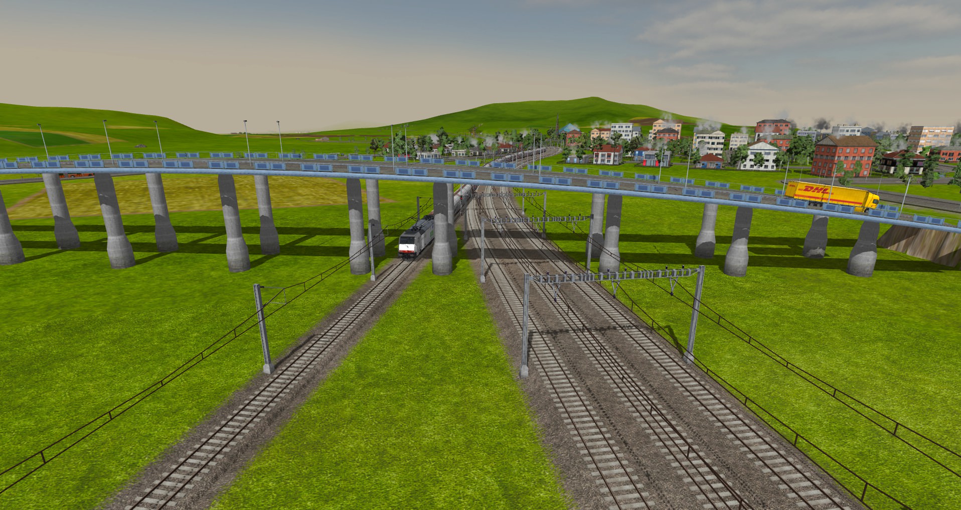 Die Br185 "Cat" mit einem Güterzug unter einer Brücke