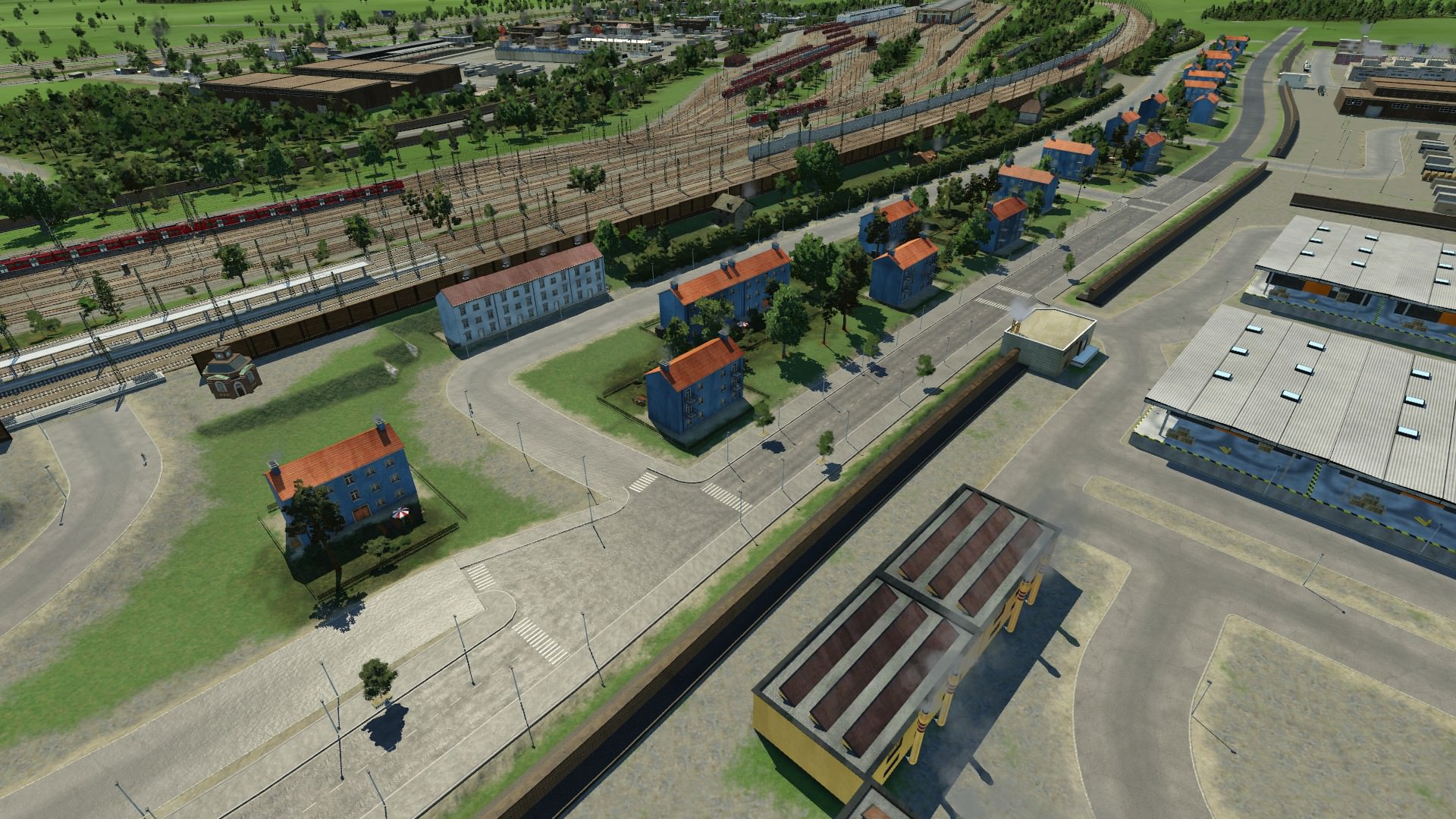 Wohnblocks, Schrebergärten & Betriebswerk im Hintergrund