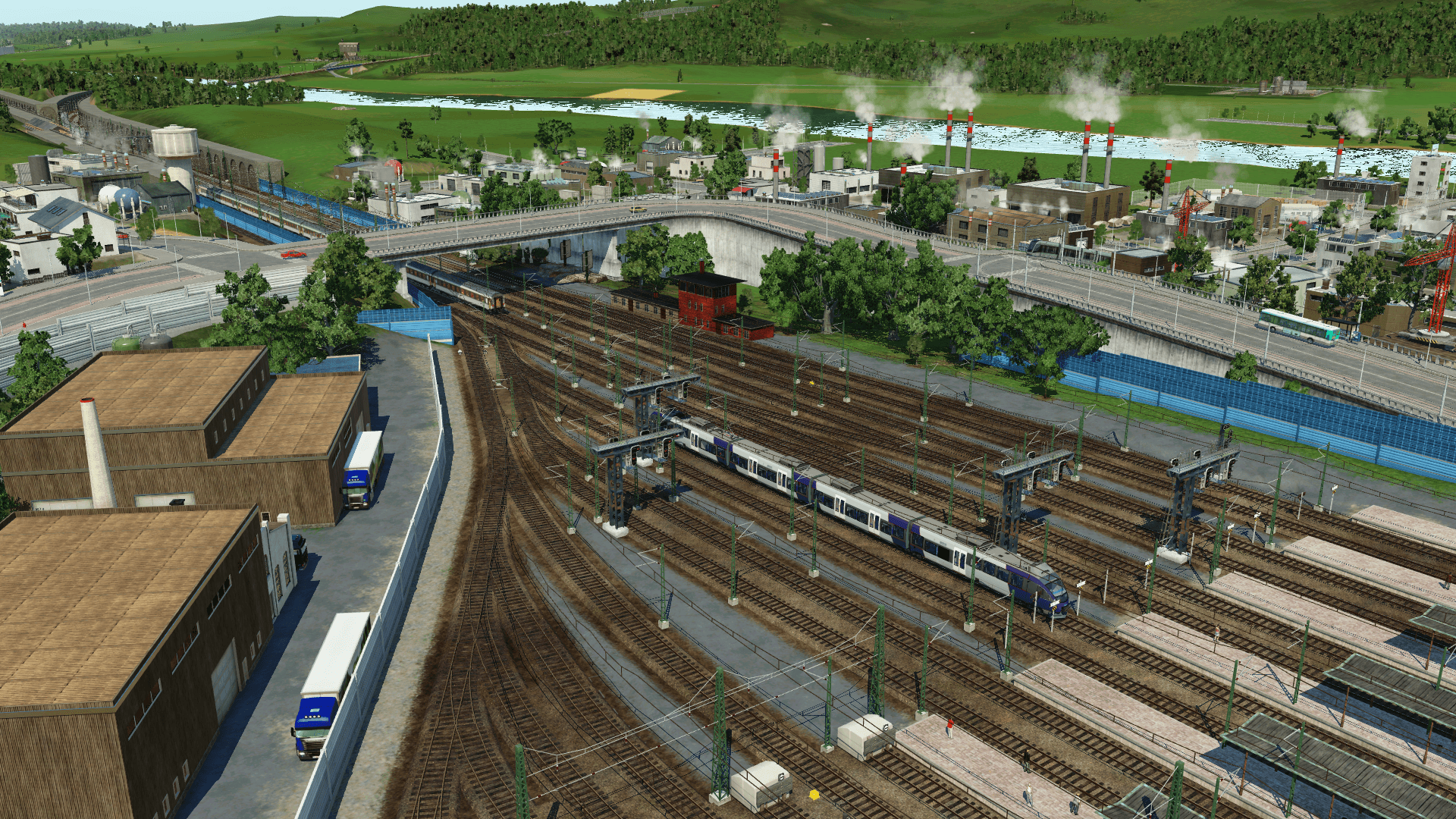 TER arrivant en gare et Intercité au départ