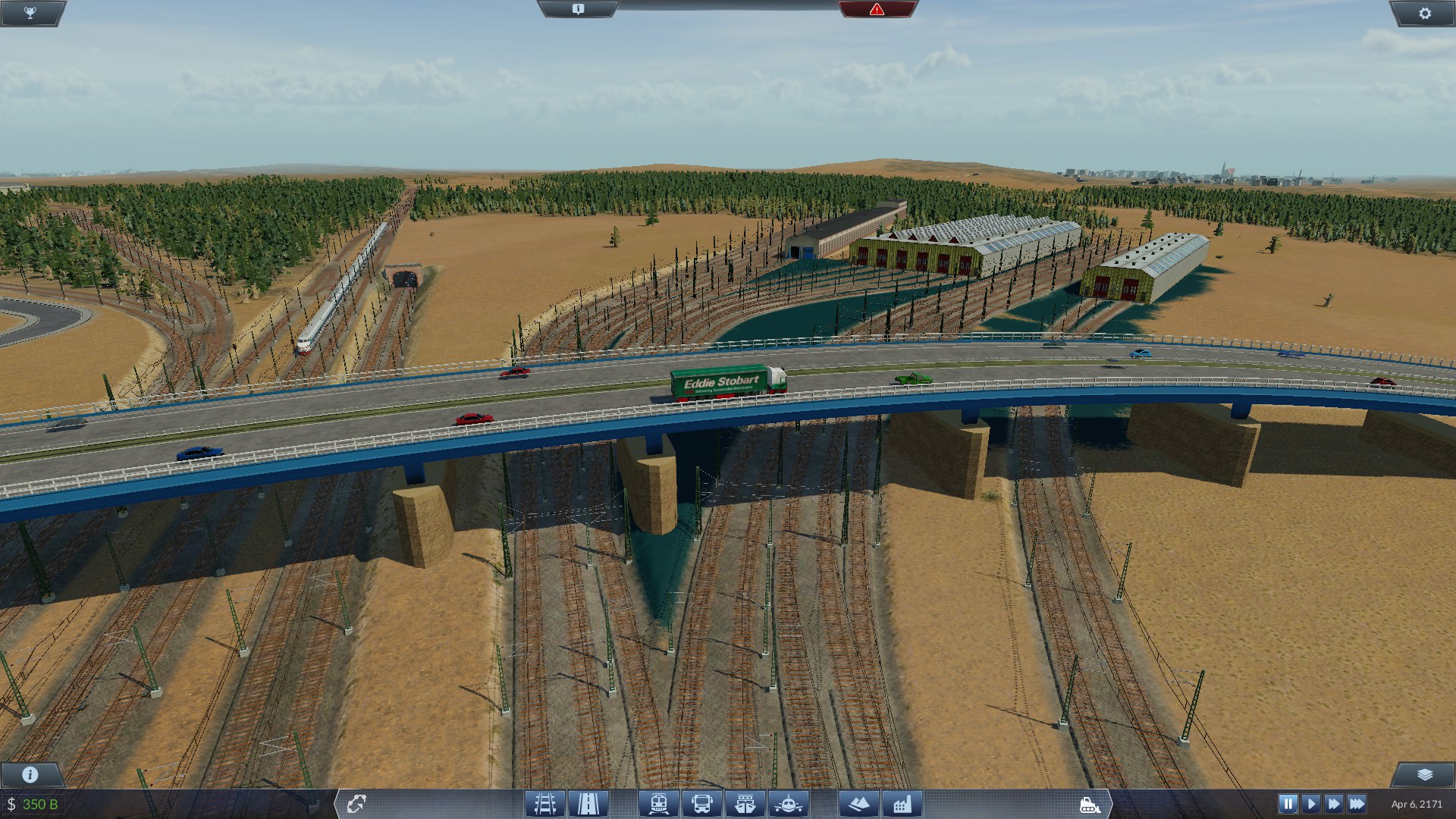 Highway E61 passes over the main yard outside of Capital City Annex with a HST moving Westbound to Manchester