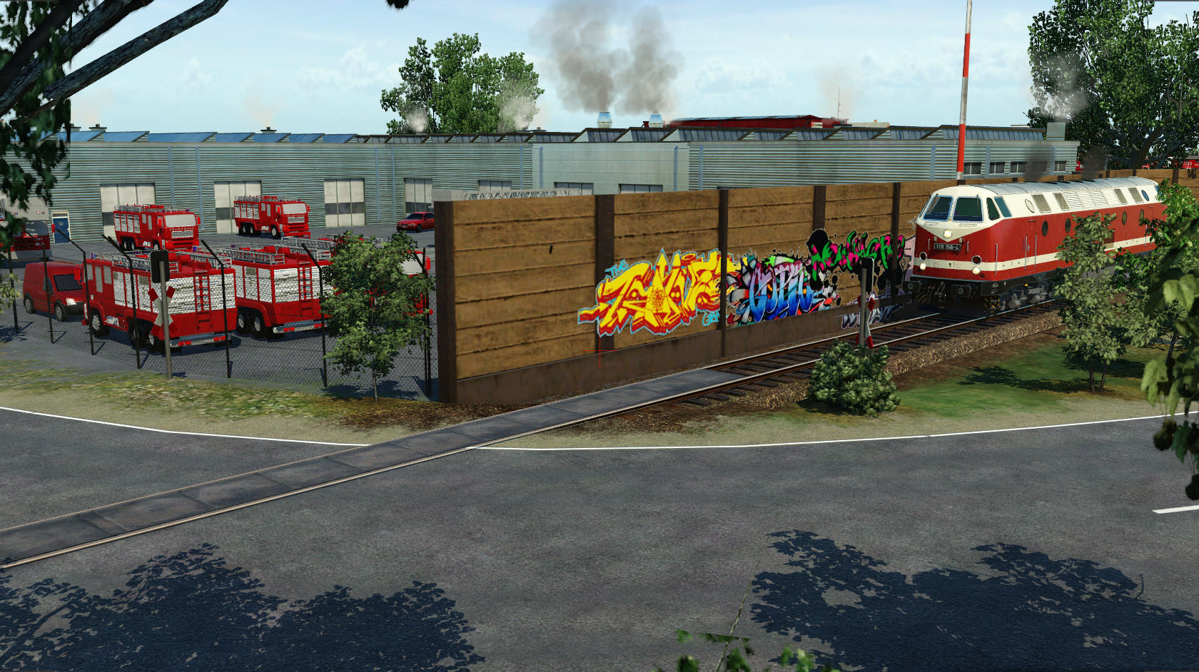 neue Map (Prignitz) - BR119 fährt entlang der Graffiti-Wand und Feuerwehr