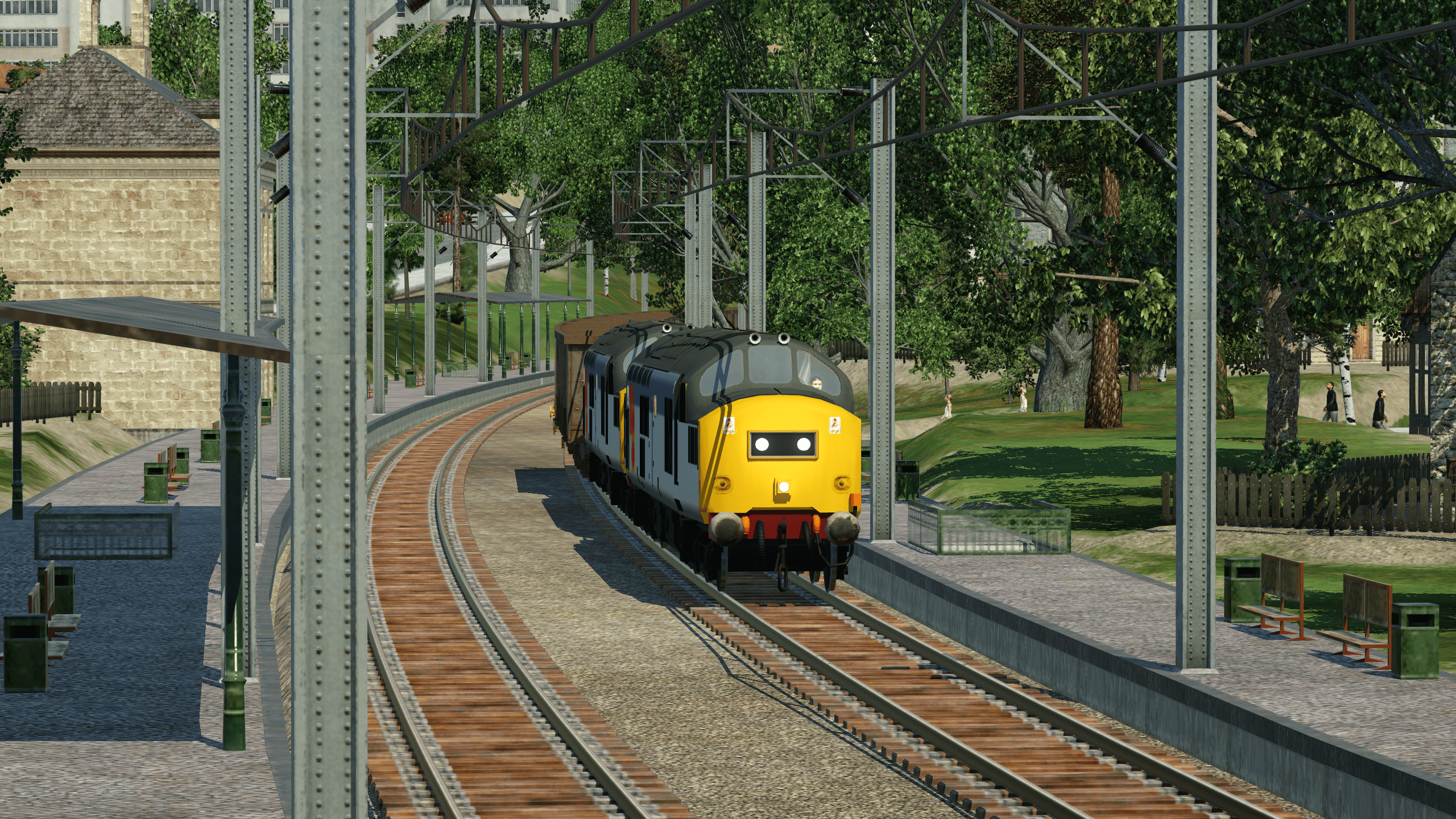 2 GB Railfreight 37s haul a long coal train through Hadfield to Fiddler's Ferry power station near Liverpool.