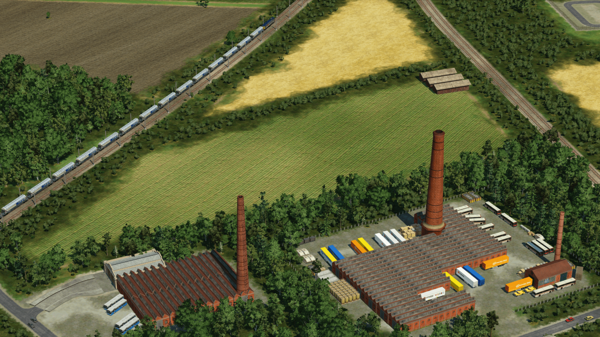 Two mills and the two converging Manchester-Leeds/Bradford lines with a Biomass train.