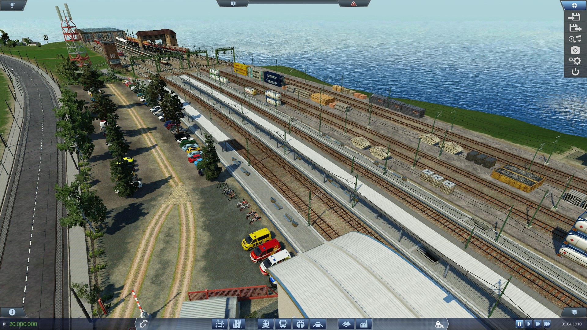 Bahnhof mit Parkplatz dahinter gleich der Güterbahnhof
