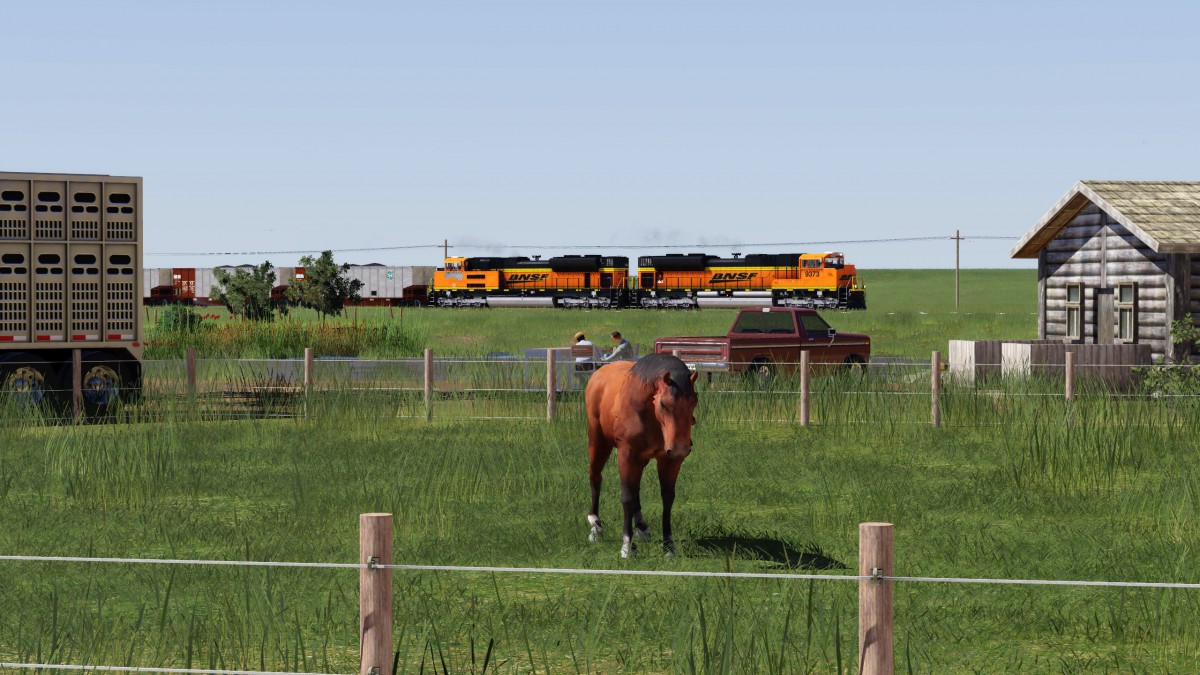 Coal train passing horses