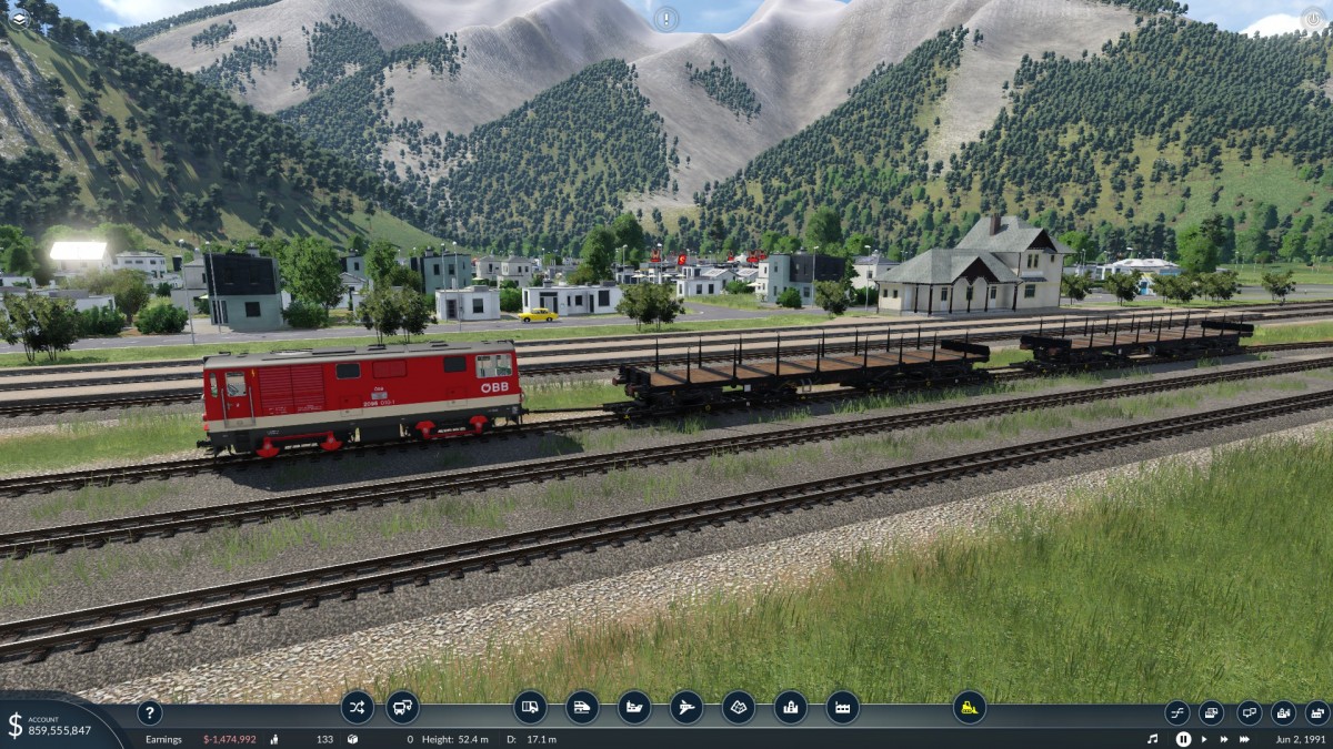 An empty yard with the exception of a freight train awaiting a special order of Timber bound for Vienna.