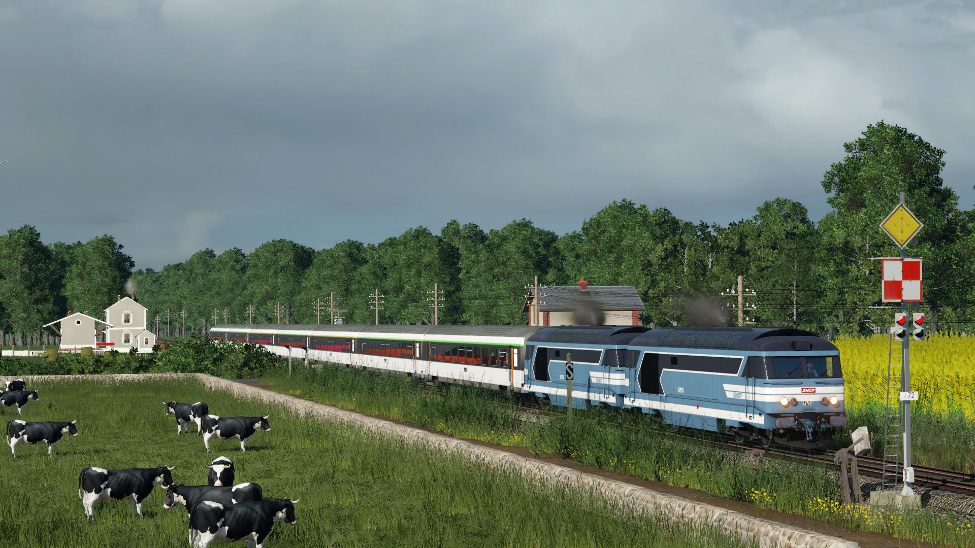 a MU of BB 67400 cross a small station