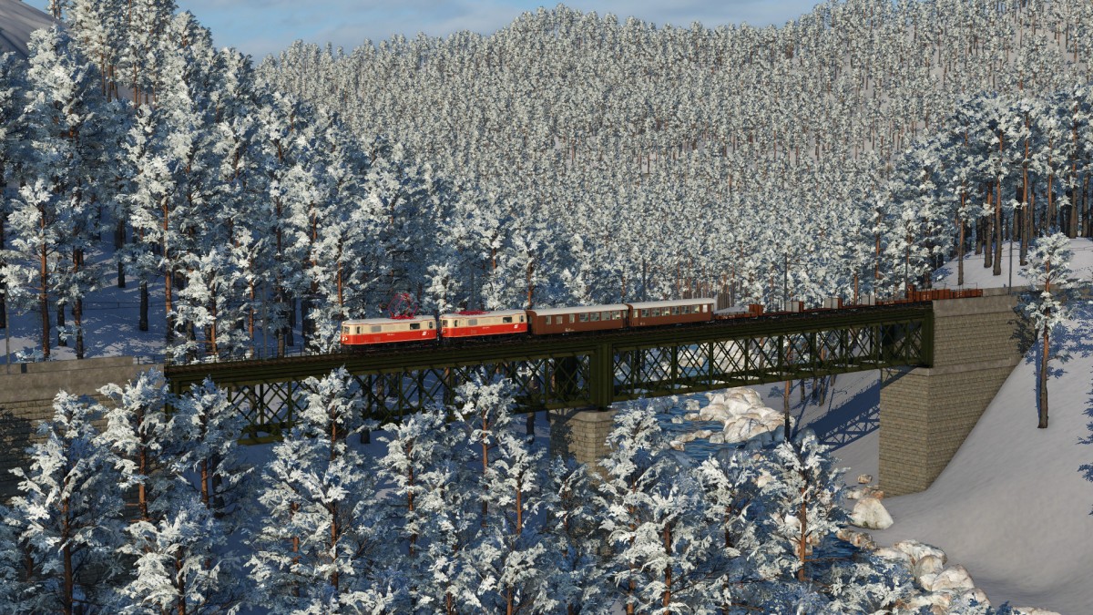 Winter atmosphere in Austria with ÖBB 1099 and mixed train