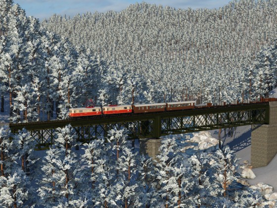Winter atmosphere in Austria with ÖBB 1099 and mixed train