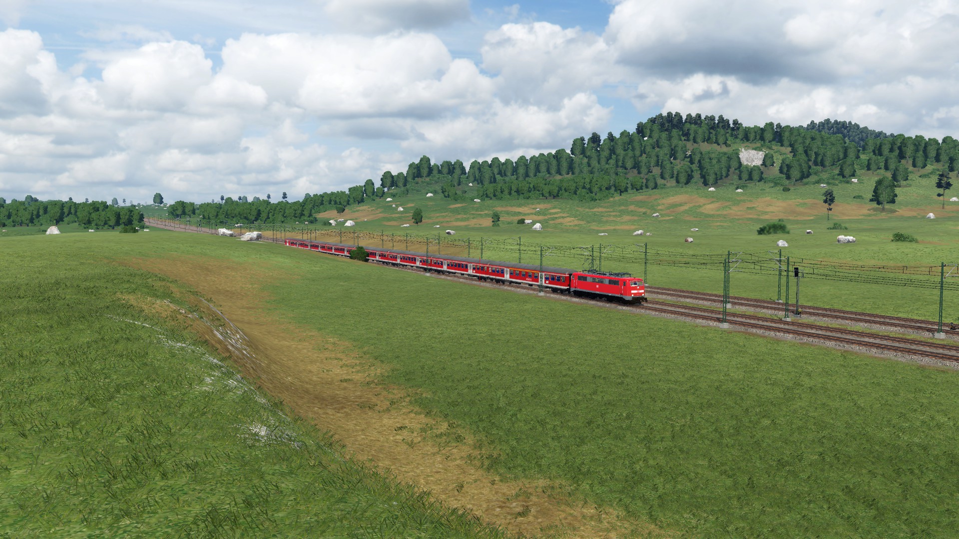 111 mit 7 n-Wagen als RE7 bei der Einfahrt in Lunestedt.