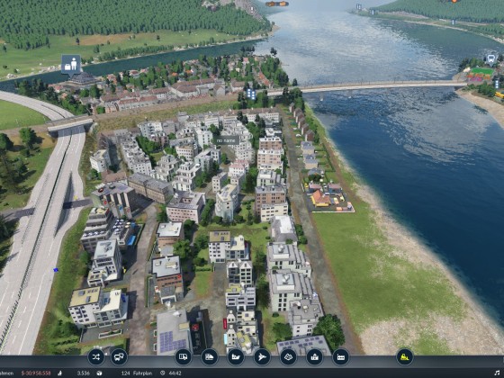 Etwas Strand mit klein Wohnungen in der gross Stadt und einem Hafen