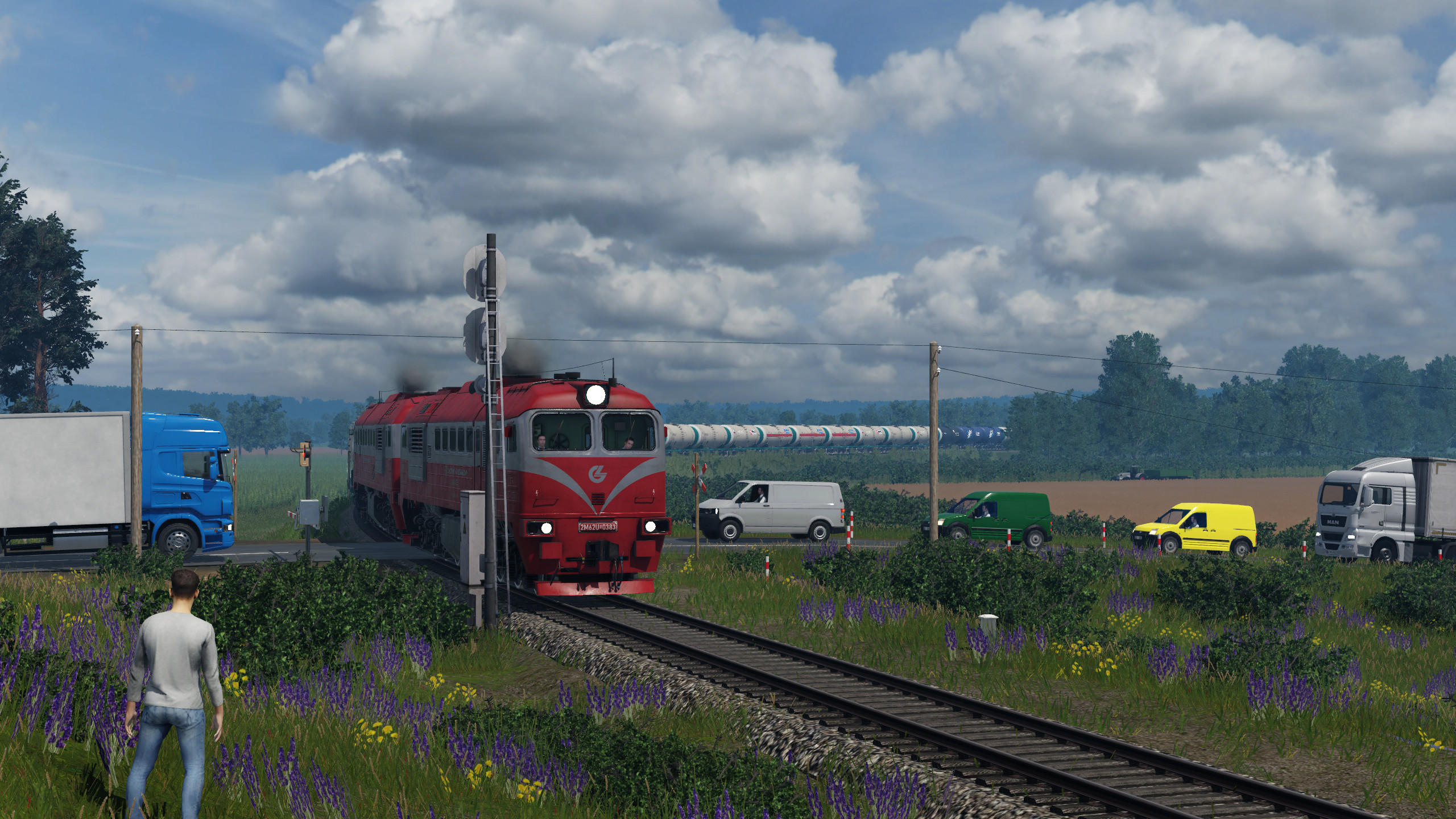 2M62UM-0383 meets the dawn at the railway crossing.