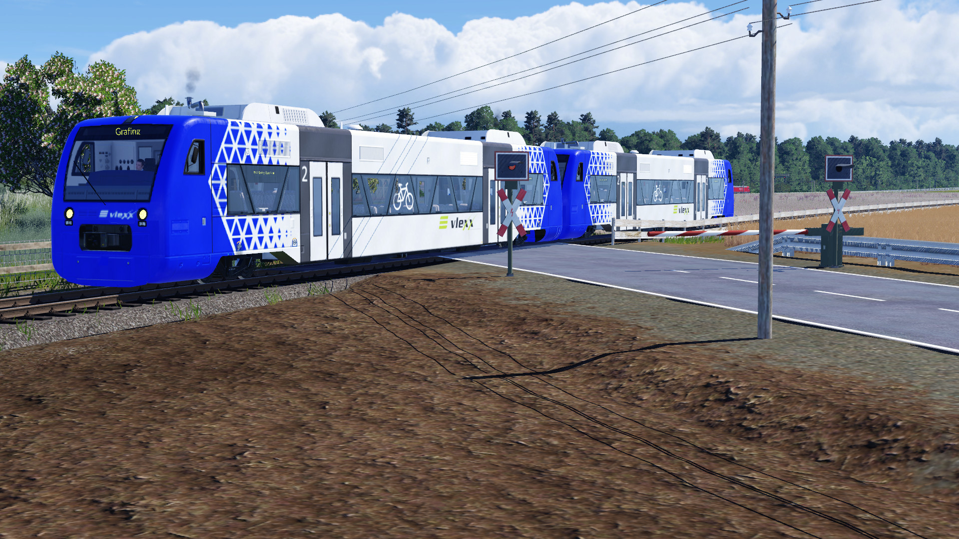 Stadler RS1/BR 650 von Vlexx bei einem BÜ