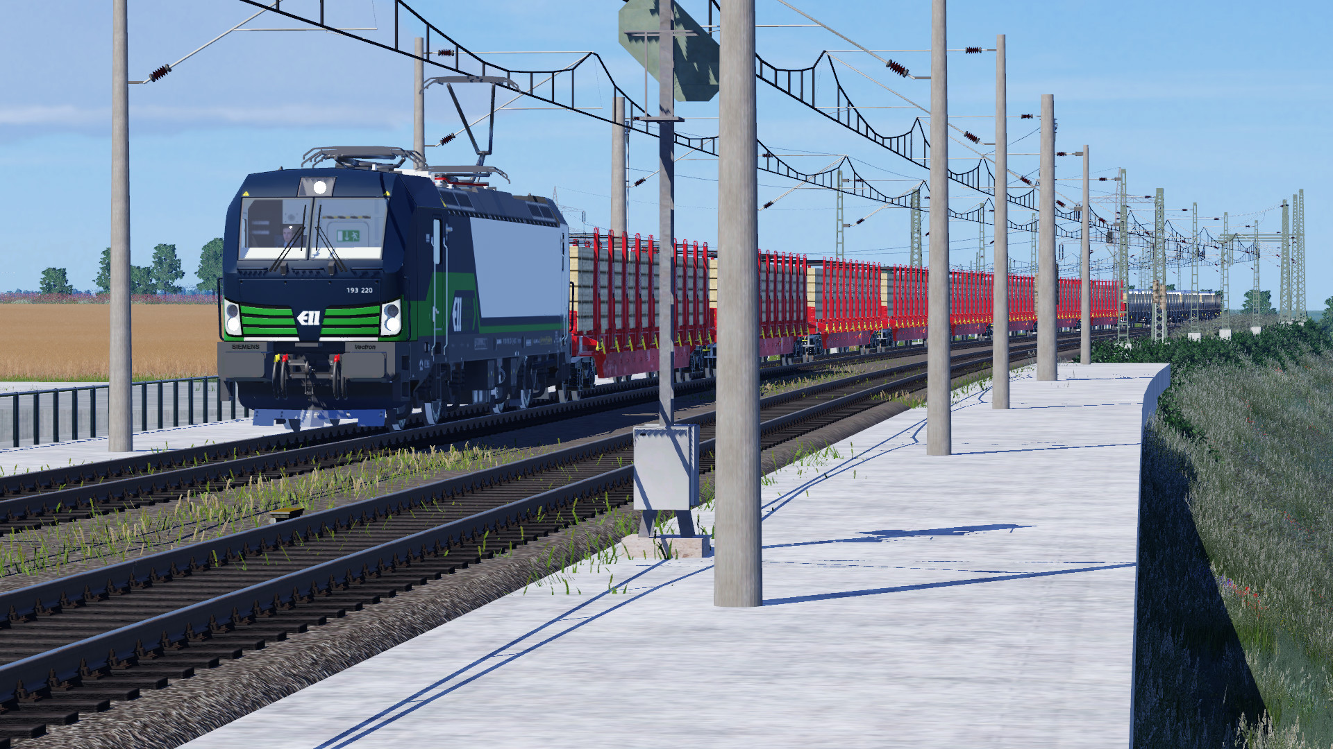 ELL Vectron mit einem Güterzug