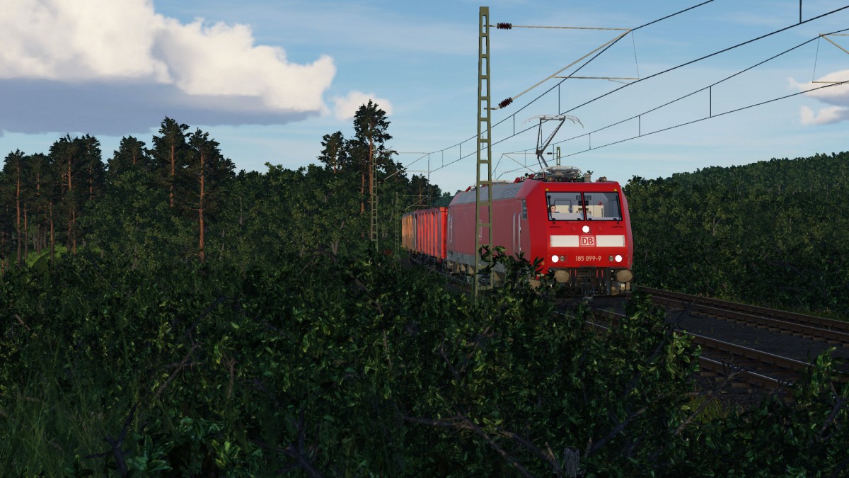BR 185.1 mit offenem Güterwagen Zug