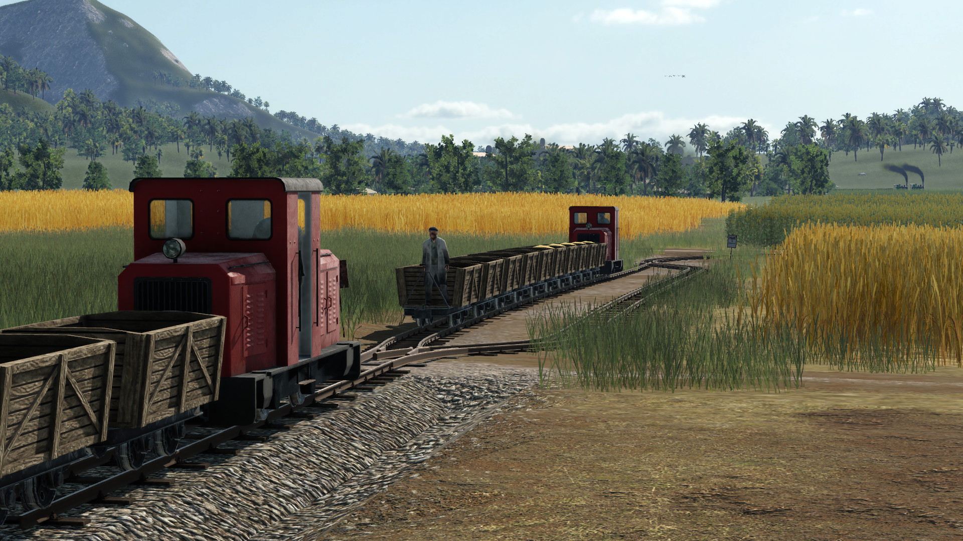 Feldbahn fährt auf Bauernhof und Industrieanlage "Lebensmittelfabrik"