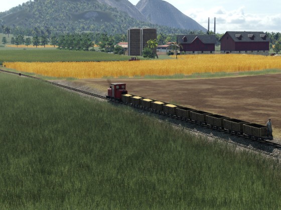 Feldbahn fährt auf Bauernhof und Industrieanlage "Lebensmittelfabrik"