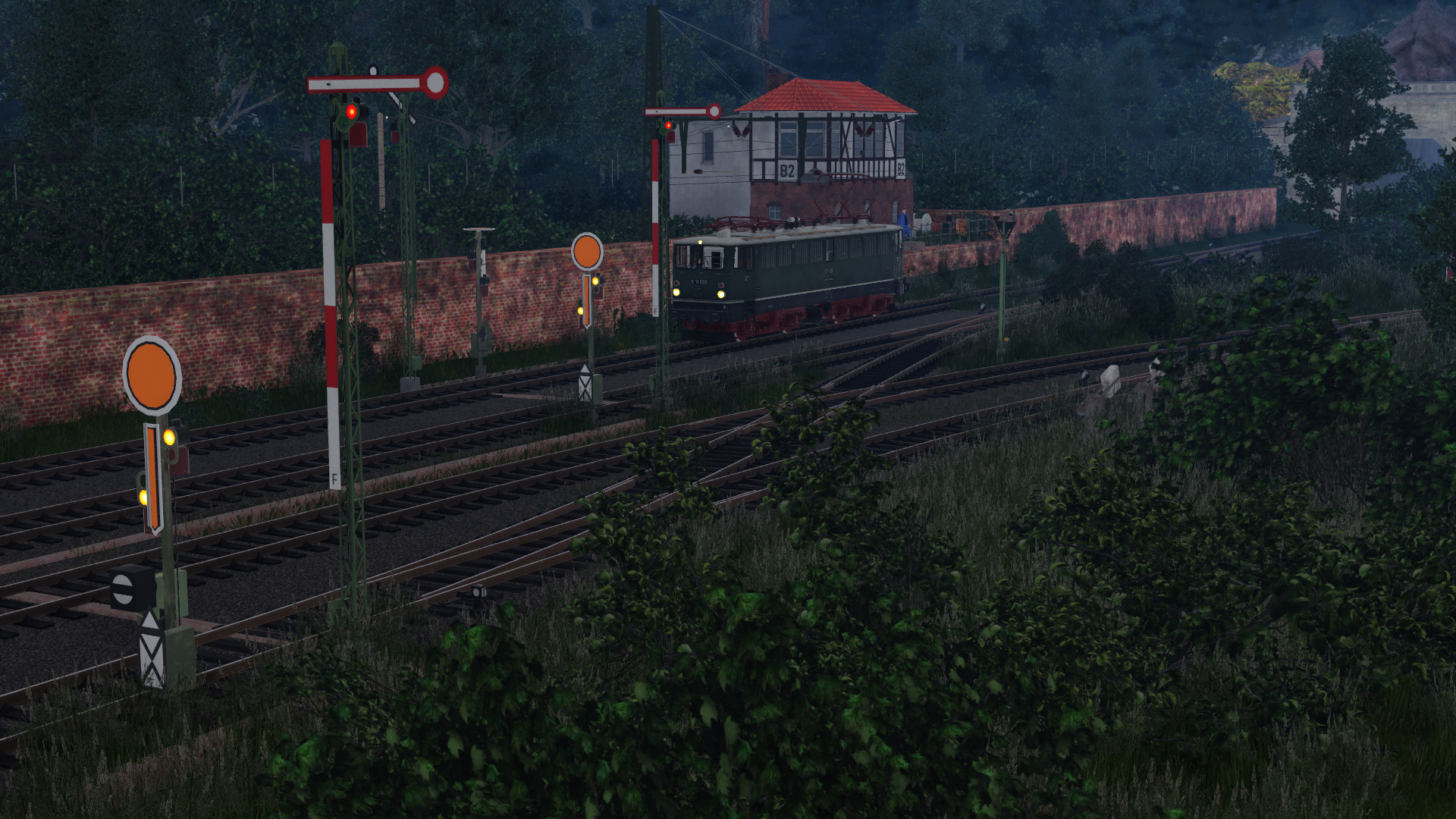 E11 028 in Abzweig Walzen auf der Hauptstrecke