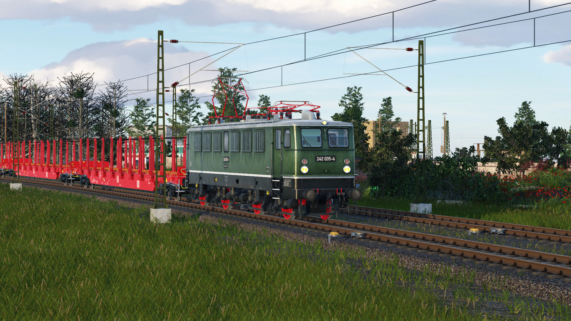 BR242 053-4 fährt am alten Kohlehaus E.V. vorbei