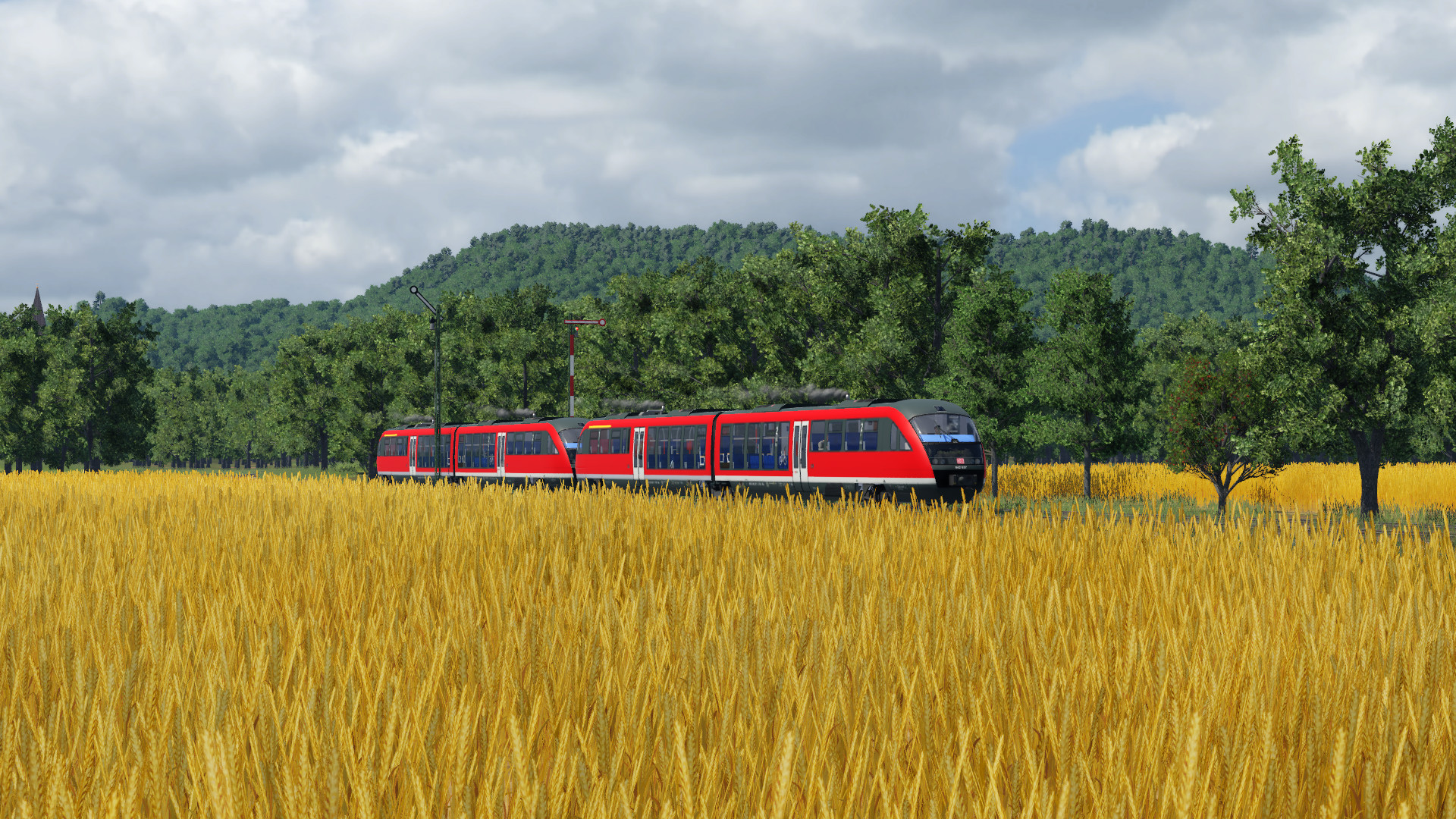 Desiro zwischen Rapsfeldern und Hügeln