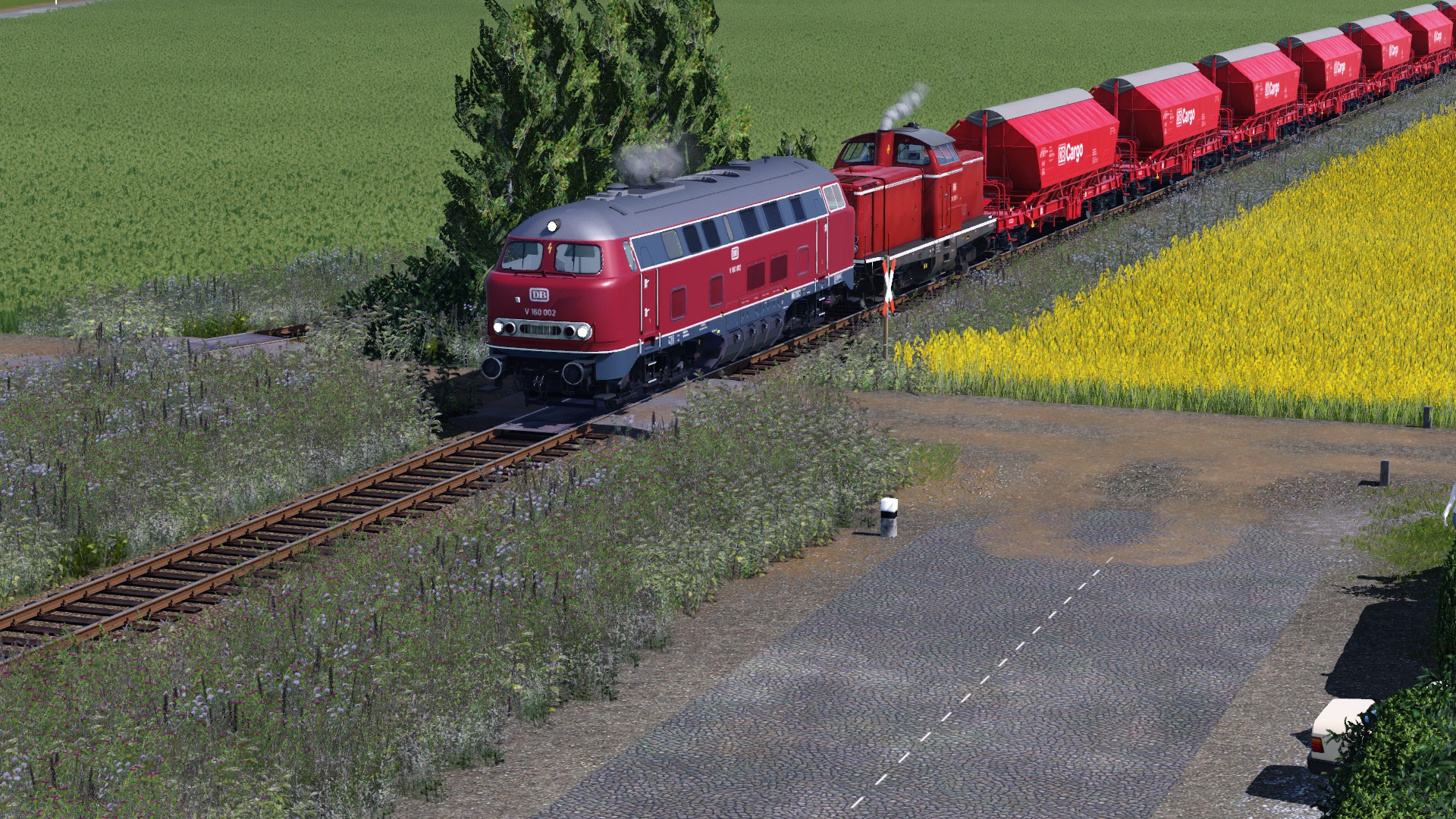 LOLO und V100 mit Getreide Zug unterwegs