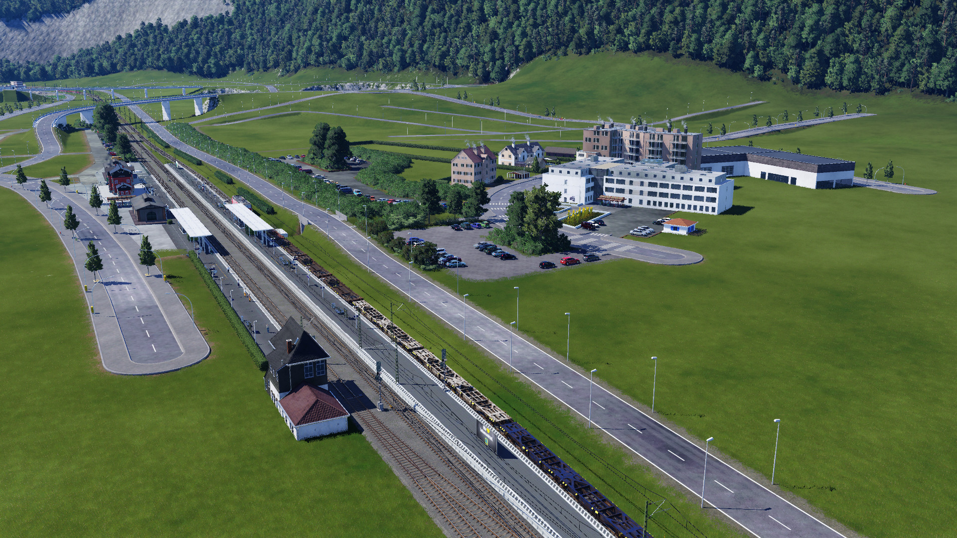 Vorläufiges Bahnhofsumfeld von Karlstadt, mit Pendlerparkplätzen und Stadtverwaltung