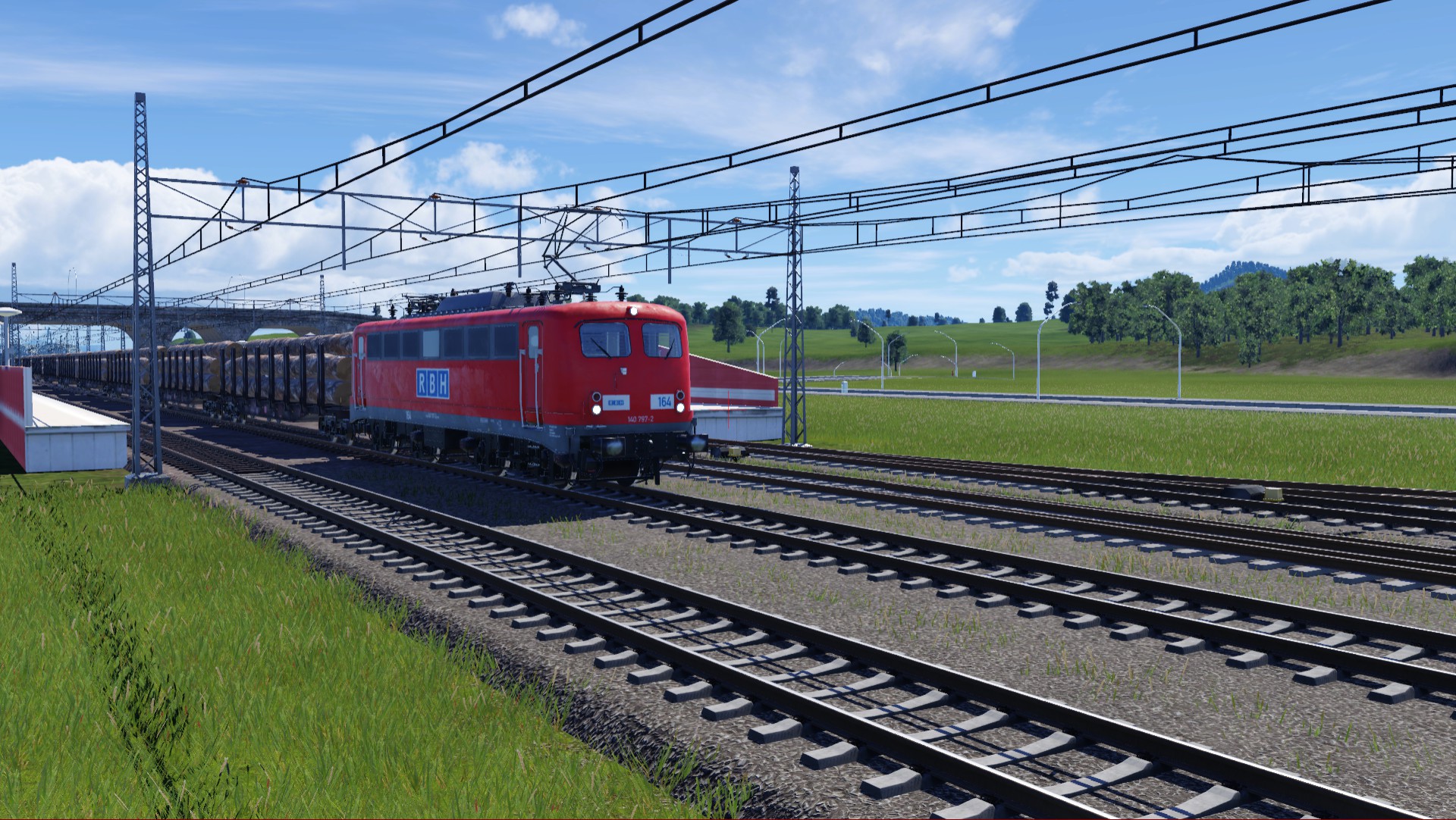 BR 140 der RBH Mit Holztransport