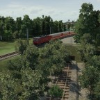 HGe 4/4 fährt mit Regio in Richtung Reiden. Im Vordergurnd die alte Strecke in Richtung Dorfkern