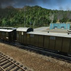 3-achsiger Packwagen am Zugende