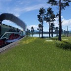 Die BR 18 201 fährt am See vorbei