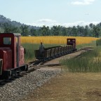 Feldbahn fährt auf Bauernhof und Industrieanlage "Lebensmittelfabrik"