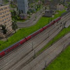Regio verlässt den Bahnhof gefolgt vom InterCity auf dem Durchgangsgleis