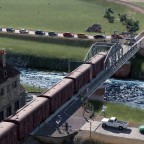 Cars waiting for the train to pass.