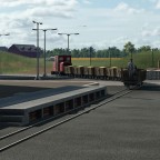 Feldbahn fährt auf Bauernhof und Industrieanlage "Lebensmittelfabrik"