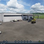 Sicht auf den Hinterhof mit zugang Werkstatt und Neufahrzeugen