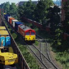 [TpF1] DB BR 66 with containers crossing the city