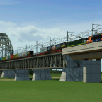 Husa 1609 in combination with a Class 66 crossing the bridge over the Ijssel